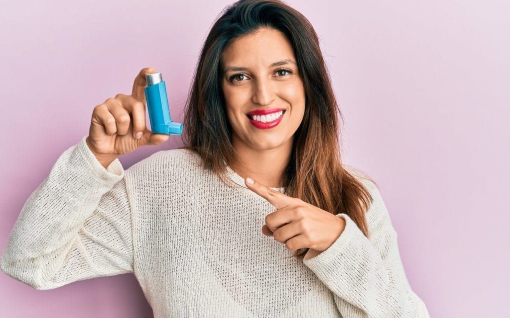 Woman Holding Asthma Inhaler