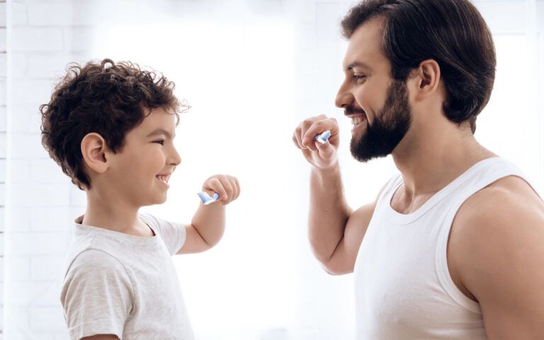 Father and Son Brushign Teeth