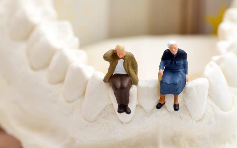 Elderly patients on a jawbone model