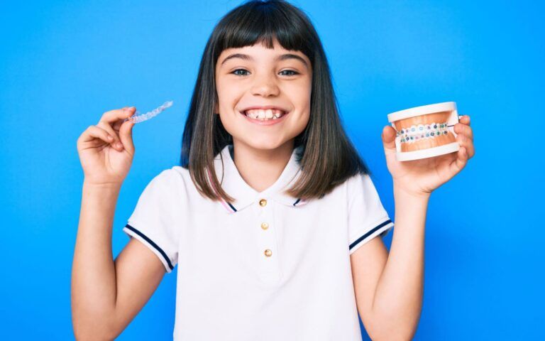 Young Child Showing Off Orthodontic Care