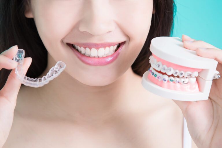 woman choice different brace on green background