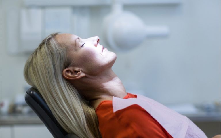 woman relaxing in dental chair