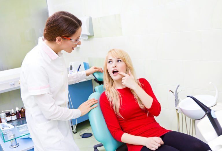 Female Patient undergoes dental checkup