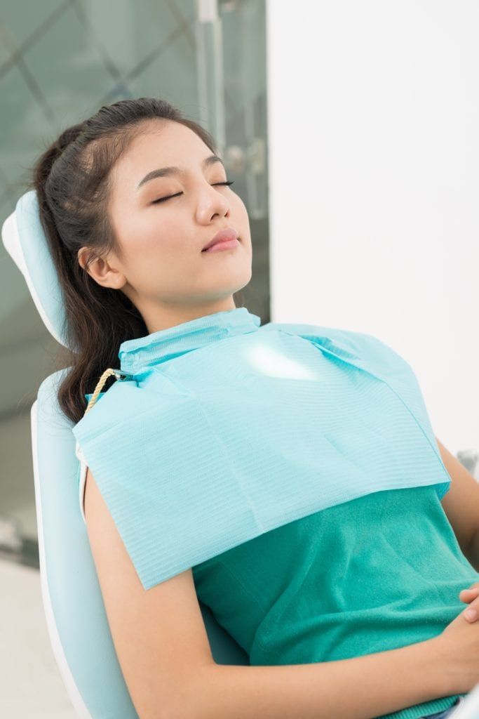 Woman sleeping in dental chair