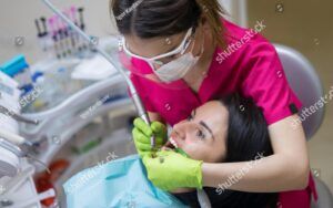 Woman recieving deep cleaning from endodontist