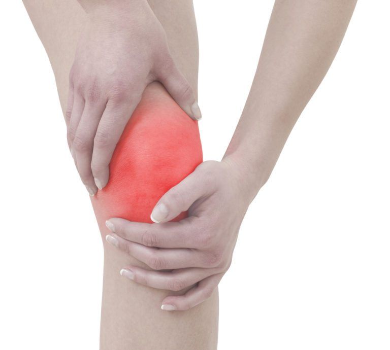 person holding knee in pain