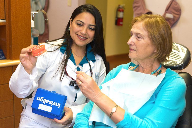 Dr. Saboowala explaining a dental procedure to her patient 06