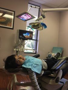 A kid at dental treatment in De Anza Smiles office 01