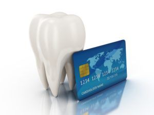 3-d rendering of a blue credit card resting up against a tooth