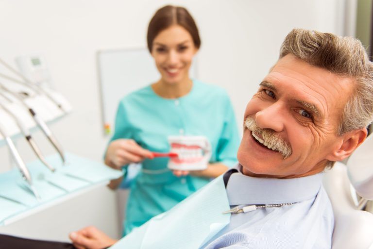Smiling old dental patient