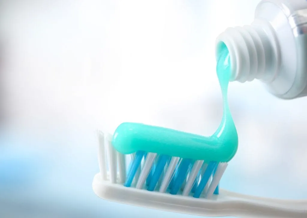 Tooth paste on tooth brush