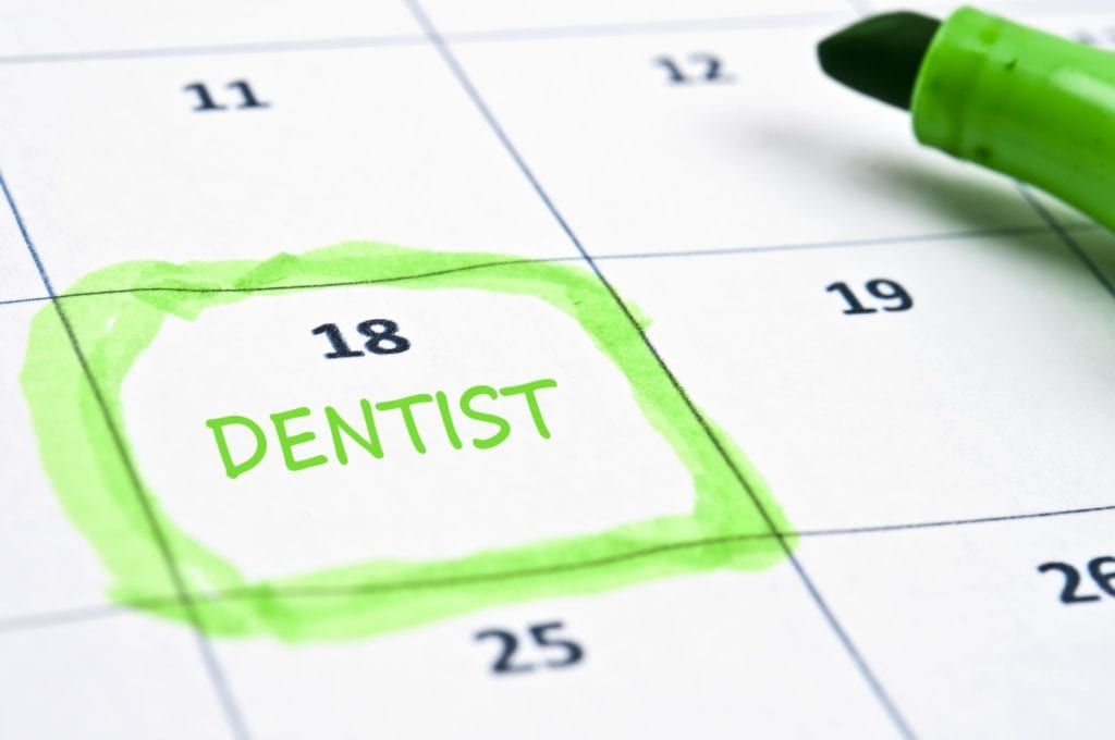 Calendar with a highlighted day labeled "dentist"