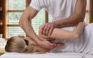 Woman undergoing a chiropractic adjustment
