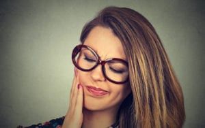 Woman Holding Side of face