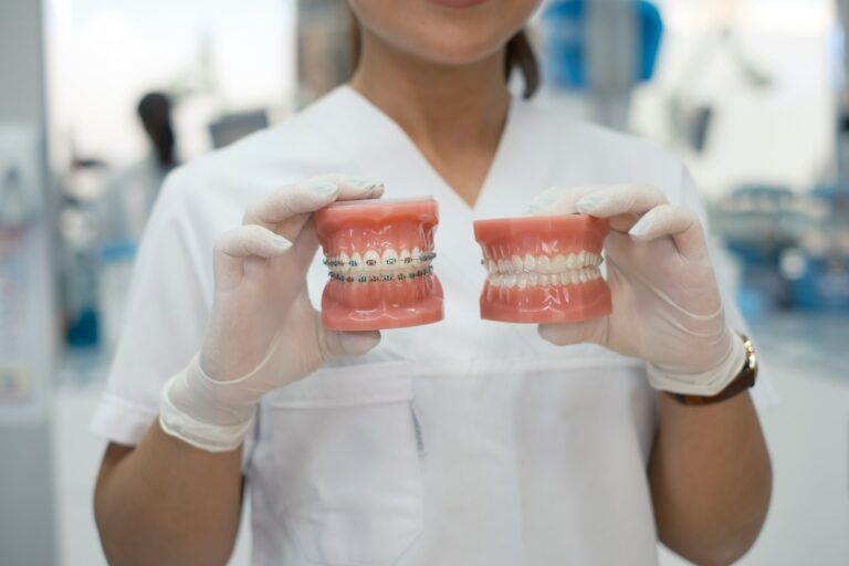 orthodontist holding braces