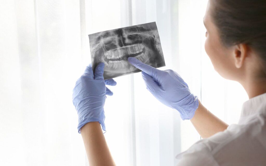 Dentist Observing X-Ray