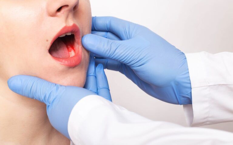 Patient Getting Mouth Examined For Orofacial Pain