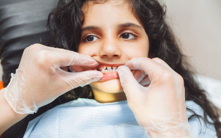 Child Recieving Checkup From Dentist