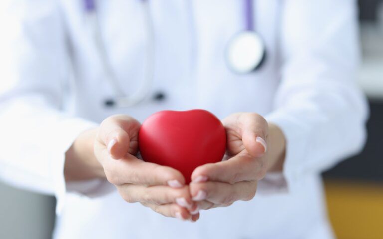 Doctor Holding Heart Mold